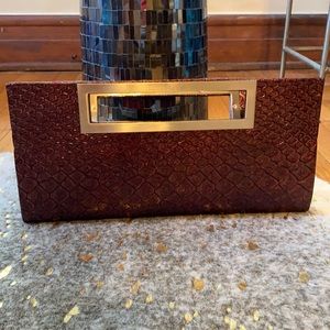 Wine eel print clutch